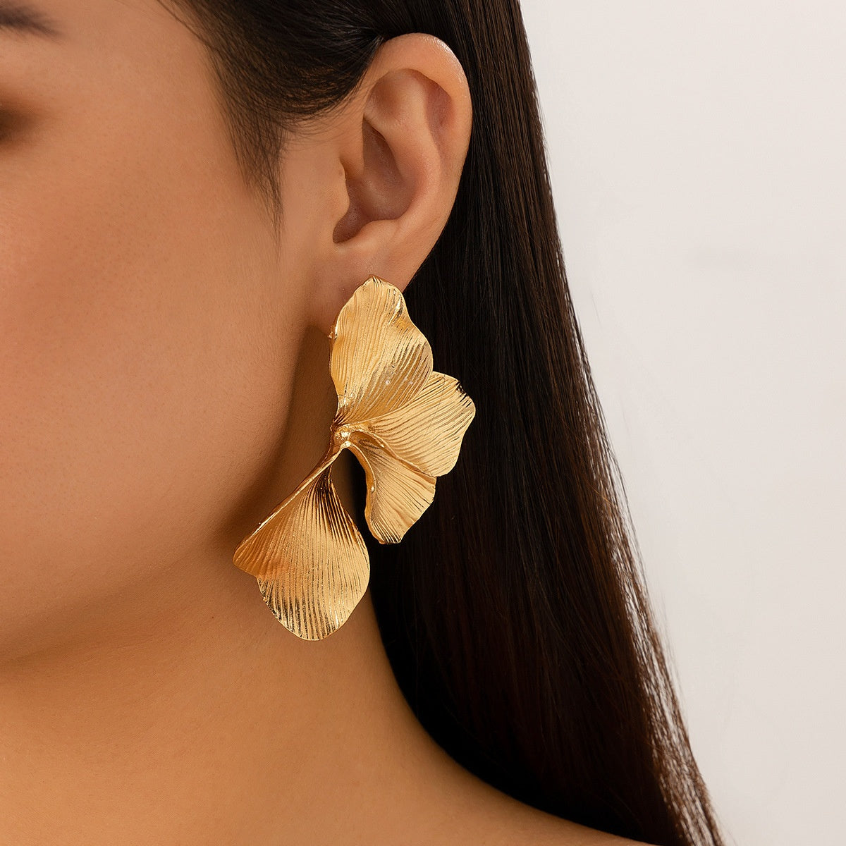 Petal gold dangle earrings for women