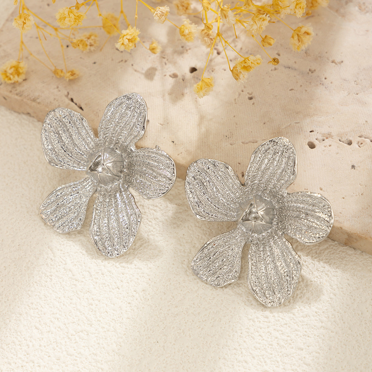 flower shaped silver earrings