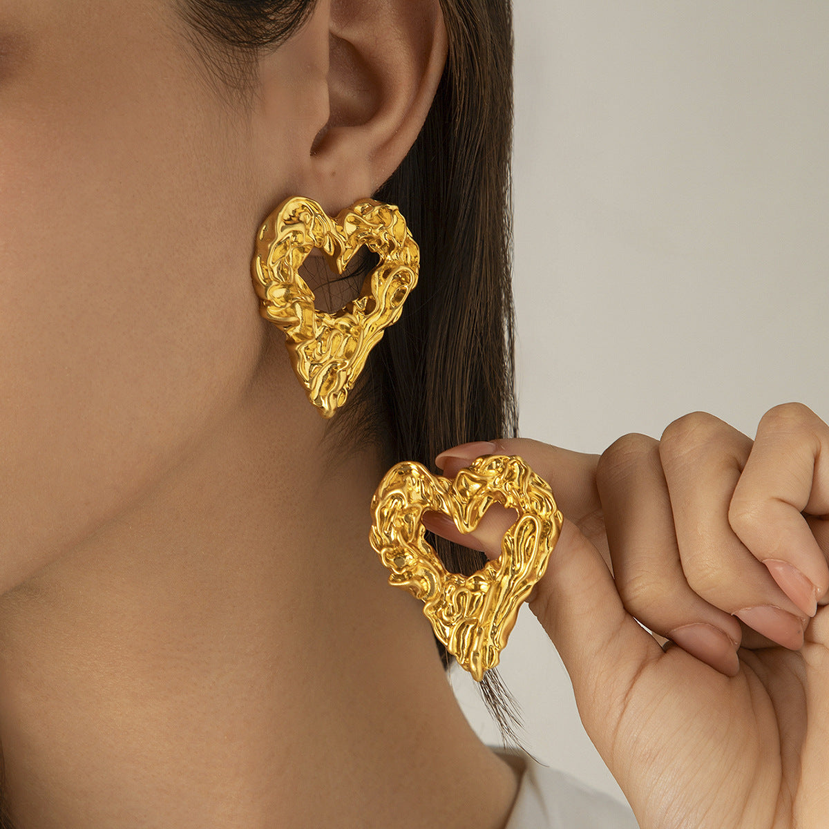 Heart shaped gold dangle earrings